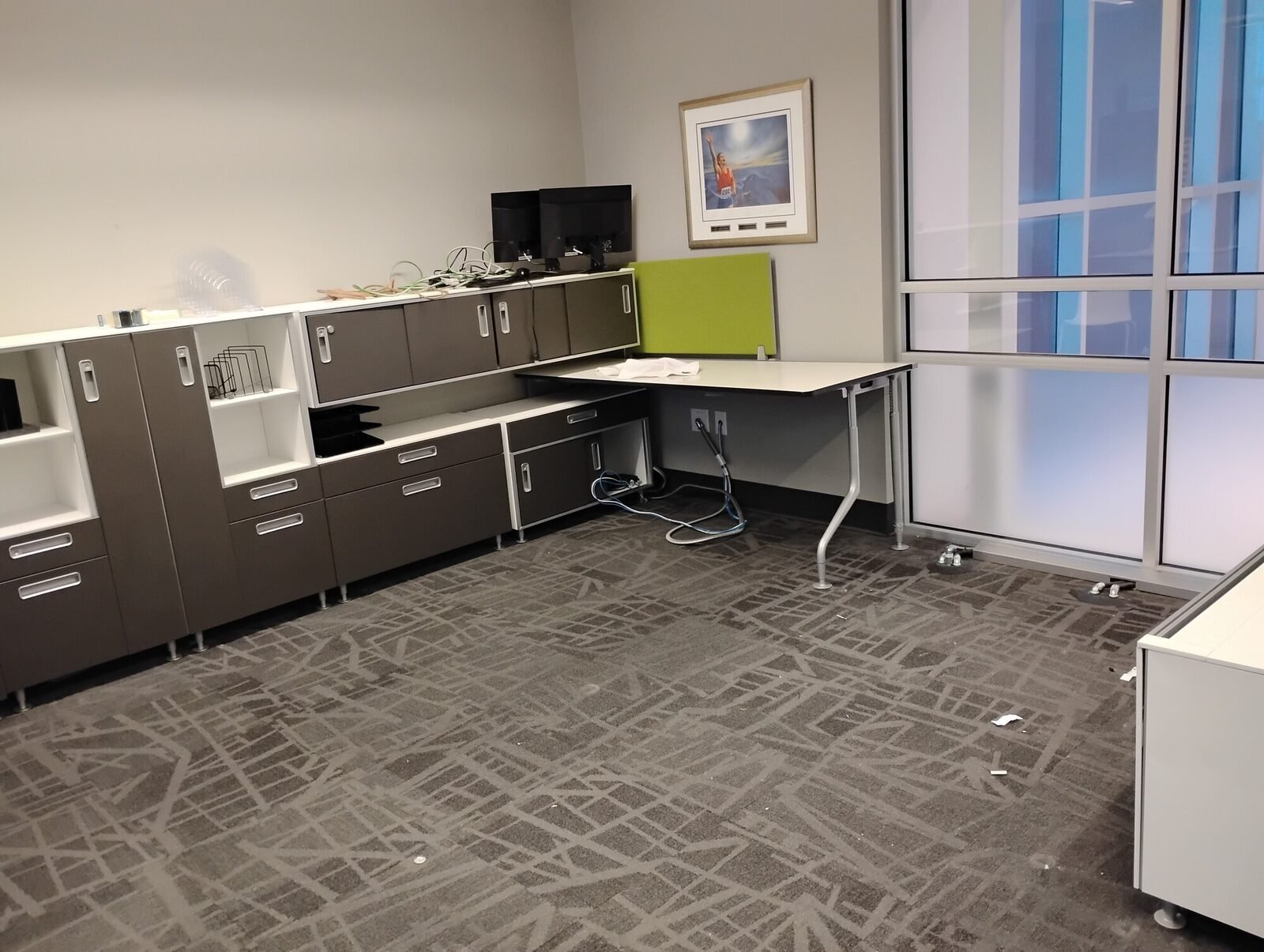 An office cleared of furniture and equipment by Clearout Crew during a commercial cleanout in the Calgary area.