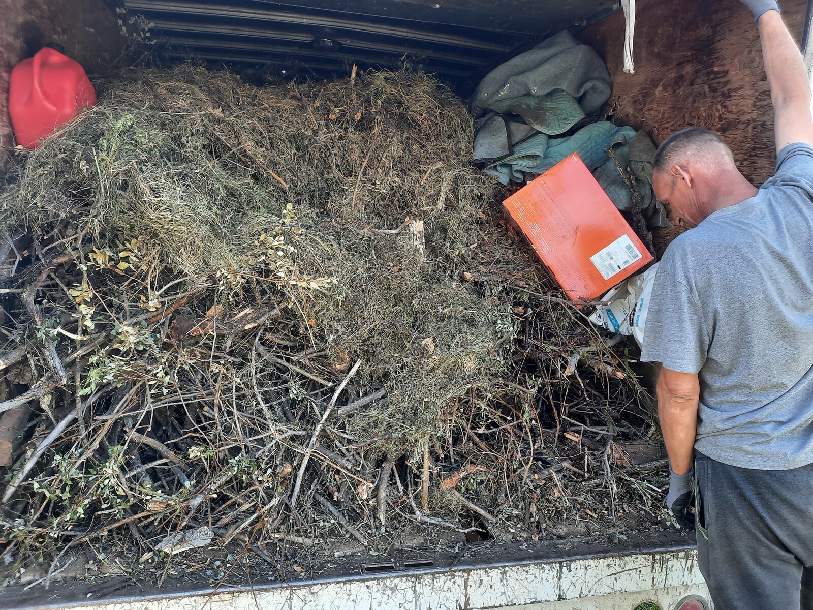 A Clearout Crew truck being loaded during a Calgary cleanout